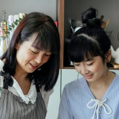 Mother and daughter cooking together. Buddhism can help you begin anew and have a healthier relationship with your parents