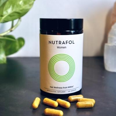 Nutrafol Women Hair Growth Supplement bottle and pills