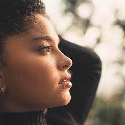 Woman looking into sunset