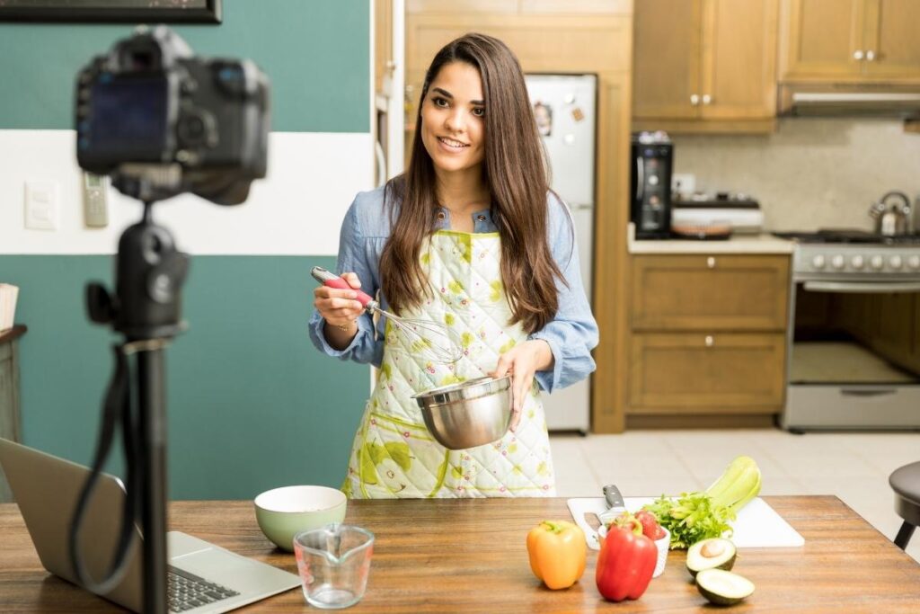 Female vlogger looking confident in front of the camera. Use affirmations for confidence to feel powerful and exude charisma.