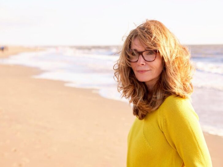 Menopausal woman walking on the beach