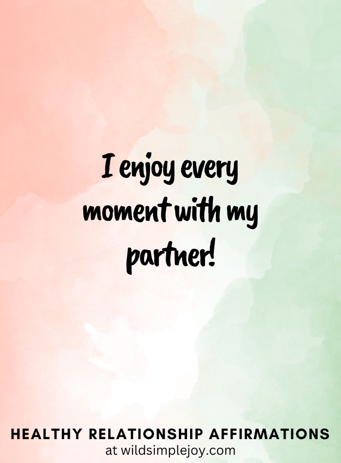 Vertical pin image with pink and green watercolor background and text overlay, I enjoy every moment with my partner! Affirmations for Relationships Wild Simple Joy