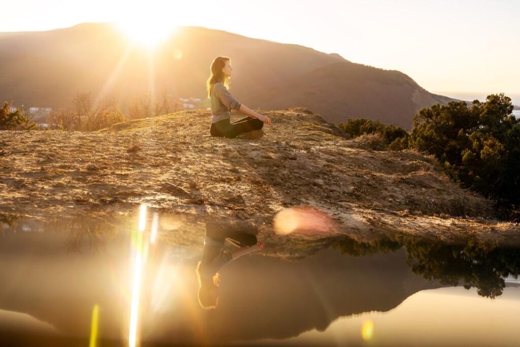 Woman practicing transformational forgiveness with affirmations and meditation