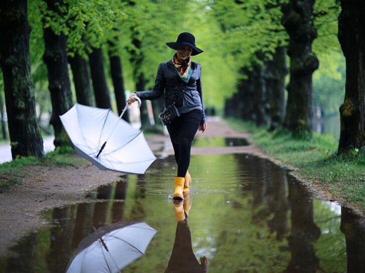 Woman releasing resentment and bitterness with affirmations while walking in the rain