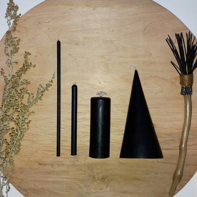 Different black spell candles