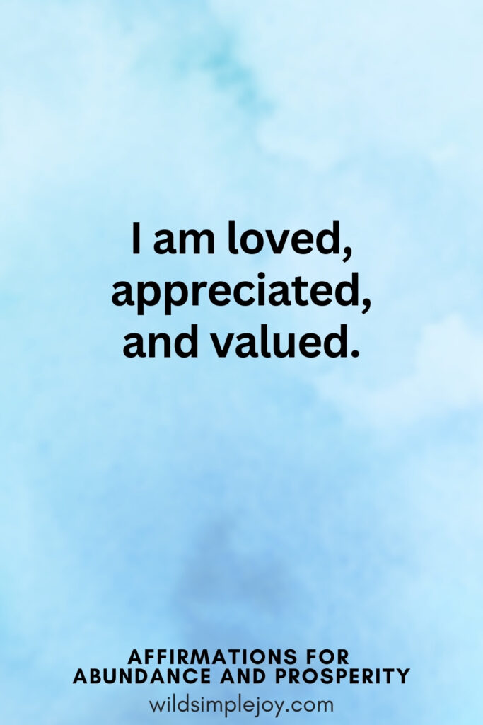 Vertical pin image with blue watercolor background and text overlay, I am loved, appreciated, and valued. Affirmations for Abundance and Prosperity