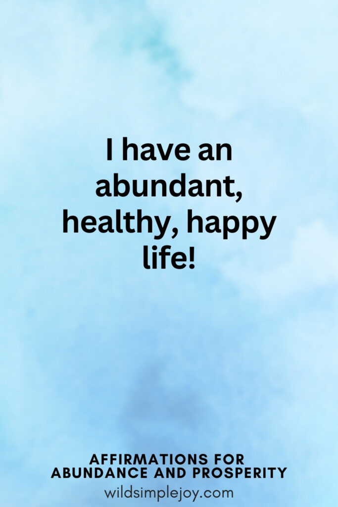 Vertical pin image with blue watercolor background and text overlay, I have an abundant healthy and happy life Affirmations for Abundance and Prosperity