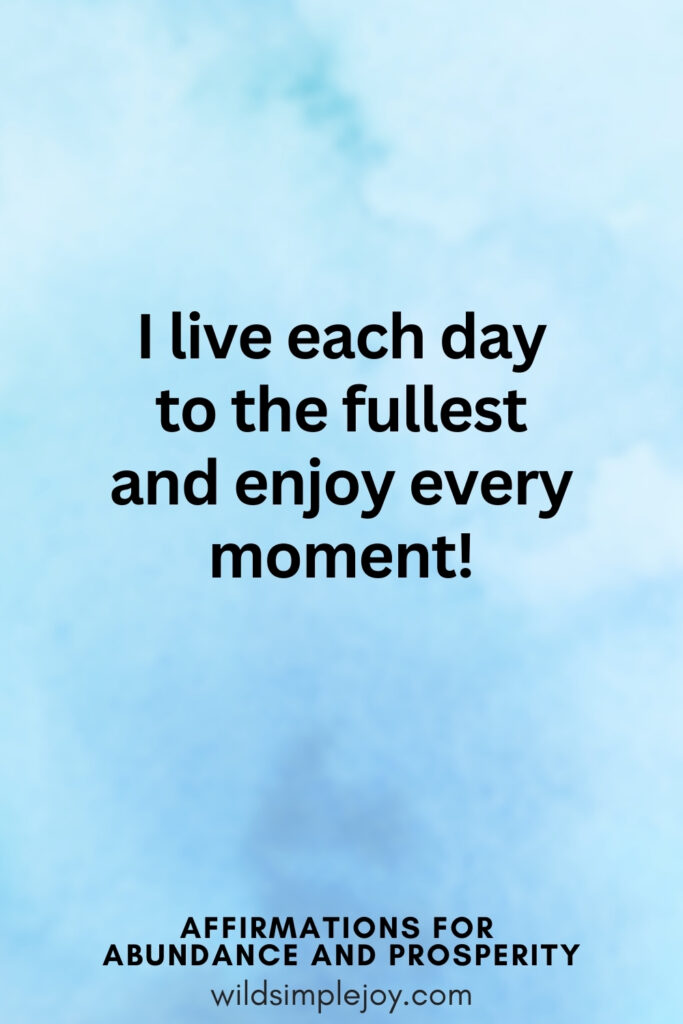 Vertical pin image with blue watercolor background and text overlay, I live each day to the fullest and enjoy every moment. Affirmations for Abundance and Prosperity