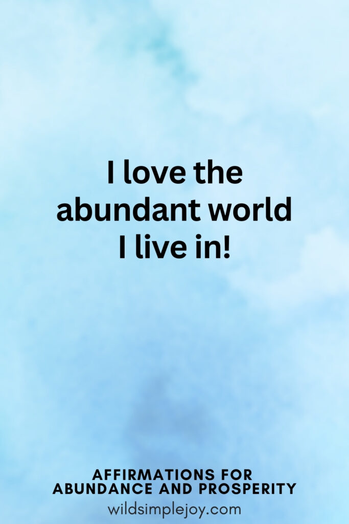 Vertical pin image with blue watercolor background and text overlay, I love the abundant world I live in! Affirmations for Abundance and Prosperity