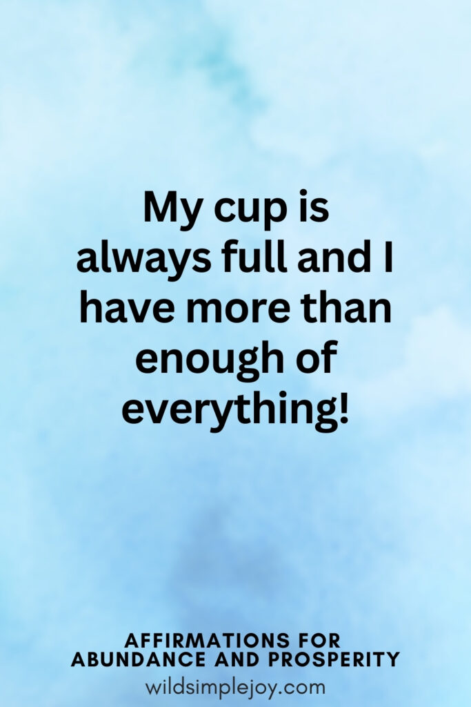 Vertical pin image with blue watercolor background and text overlay, My cup is always full and I have more than enough of everything. Affirmations for Abundance and Prosperity