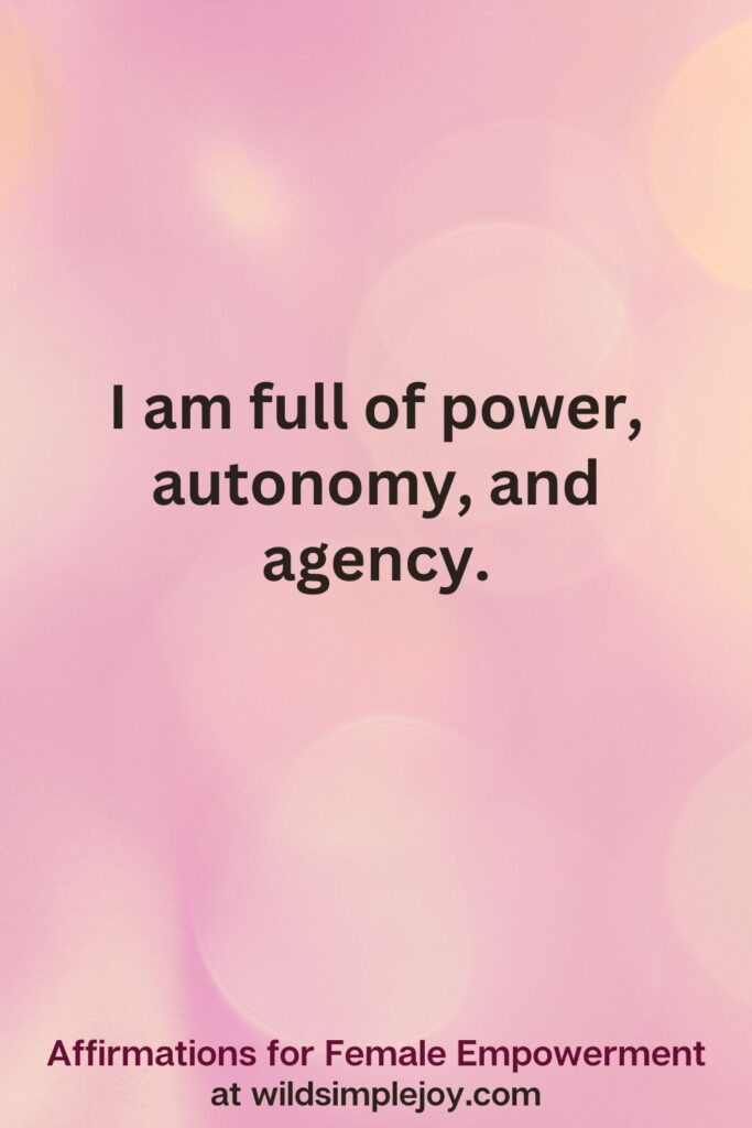Vertical pin image with pink bokeh light background and text overlay, I am full of power autonomy. Affirmations for Female Empowerment at wildsimplejoy.com
