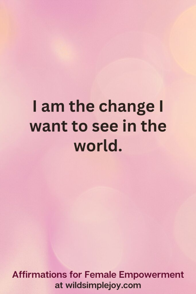 Vertical pin image with pink bokeh light background and text overlay, I am the change I want to see in the world. Affirmations for Female Empowerment at wildsimplejoy.com