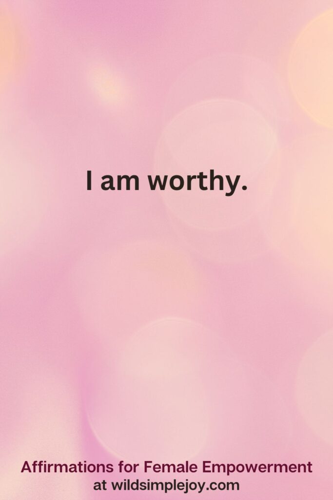 Vertical pin image with pink bokeh light background and text overlay, I am worthy Affirmations for Female Empowerment at wildsimplejoy.com