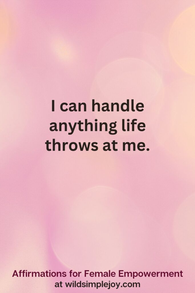 Vertical pin image with pink bokeh light background and text overlay, I can handle anything life throws at me. Affirmations for Female Empowerment at wildsimplejoy.com