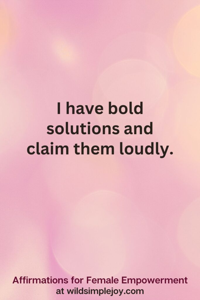 Vertical pin image with pink bokeh light background and text overlay, I have bold solutions and claim them loudly. Affirmations for Female Empowerment at wildsimplejoy.com