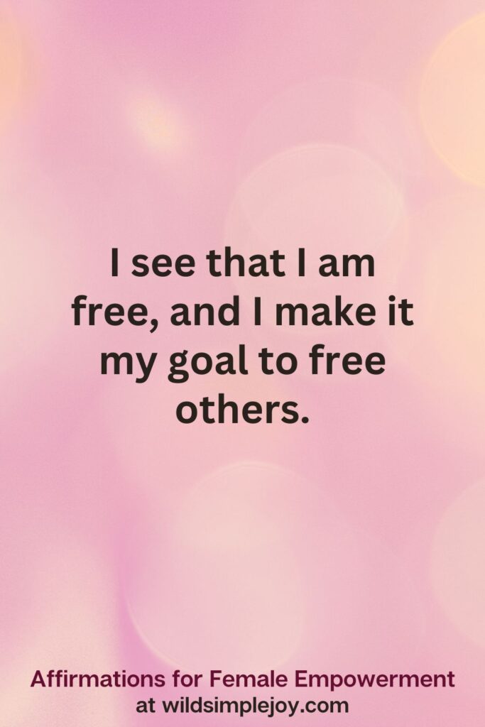 Vertical pin image with pink bokeh light background and text overlay, I see that I am free, and I make it my goal to free others. Affirmations for Female Empowerment at wildsimplejoy.com