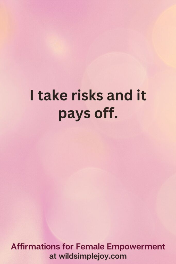 Vertical pin image with pink bokeh light background and text overlay, I take risks and it pays off. Affirmations for Female Empowerment at wildsimplejoy.com