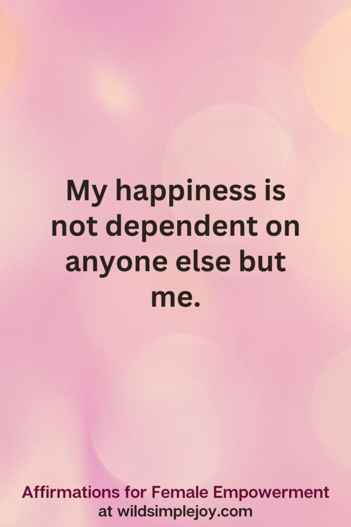 Vertical pin image with pink bokeh light background and text overlay, My happiness is not dependent on anyone else but me. Affirmations for Female Empowerment at wildsimplejoy.com