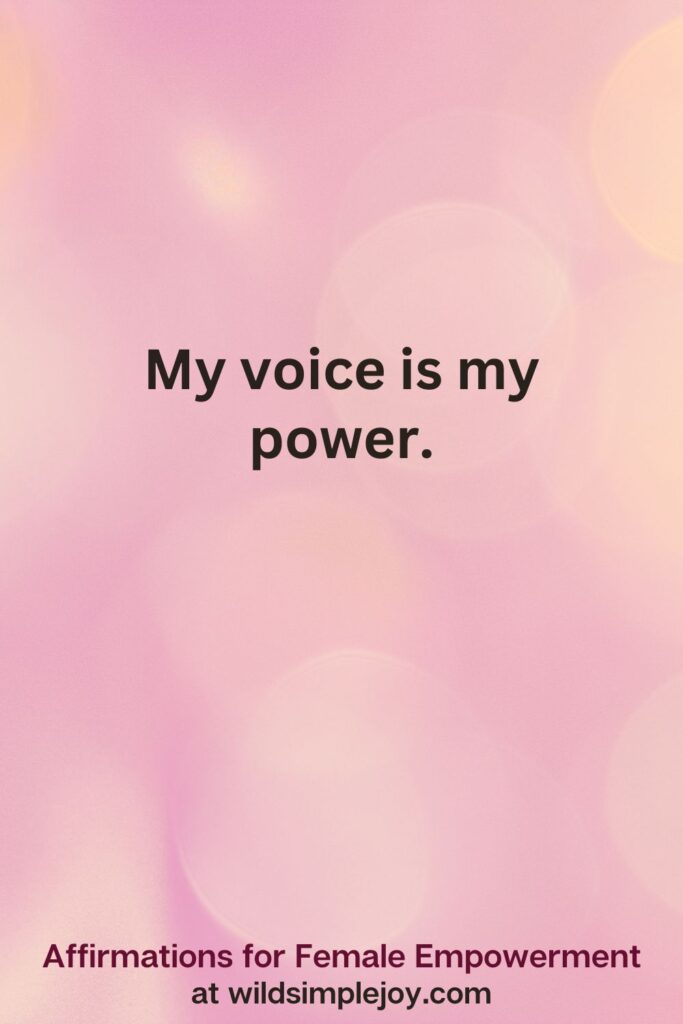 Vertical pin image with pink bokeh light background and text overlay, My voice is my power. Affirmations for Female Empowerment at wildsimplejoy.com