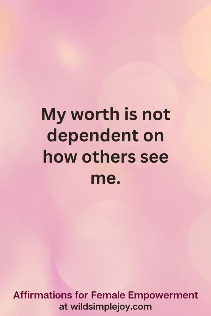 Vertical pin image with pink bokeh light background and text overlay, My worth is not dependent on others. Affirmations for Female Empowerment at wildsimplejoy.com