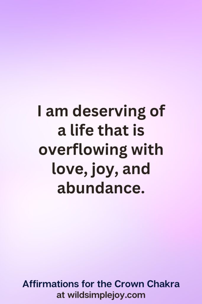 Vertical pin image with purple background and text overlay, I am deserving of a life overflowing with love. Affirmations for the Crown Chakra at wildsimplejoy.com