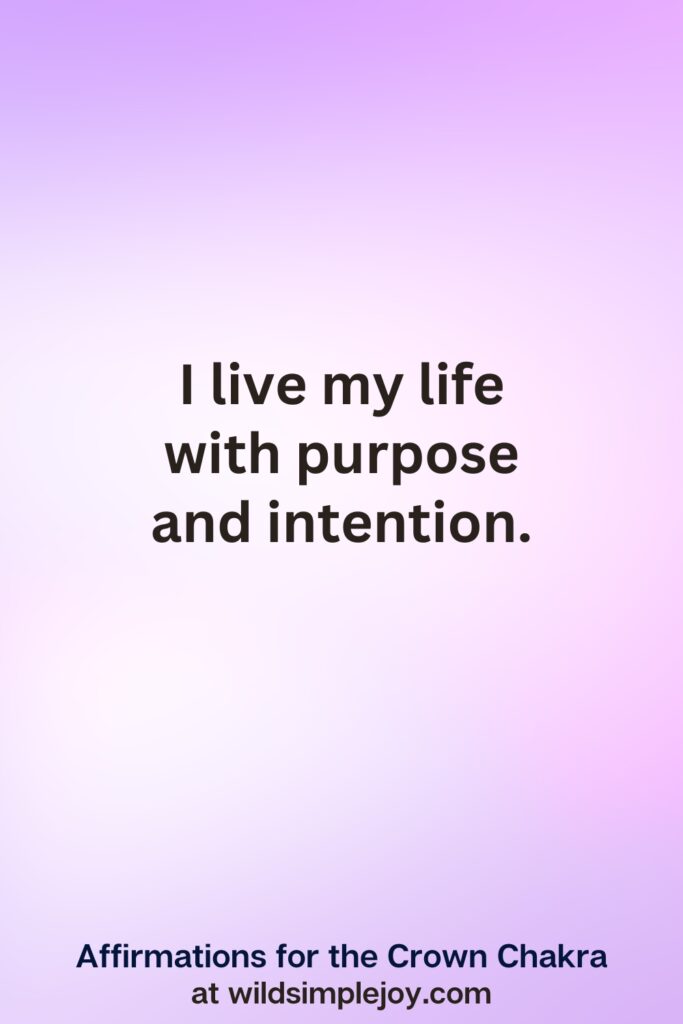 Vertical pin image with purple background and text overlay, I live my life with purpose and intention. Affirmations for the Crown Chakra at wildsimplejoy.com