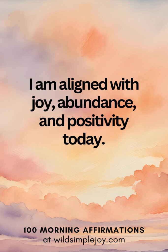 Vertical pin image with watercolor background and text overlay, I am aligned with joy and abundance. Morning Affirmations at wildsimplejoy.com