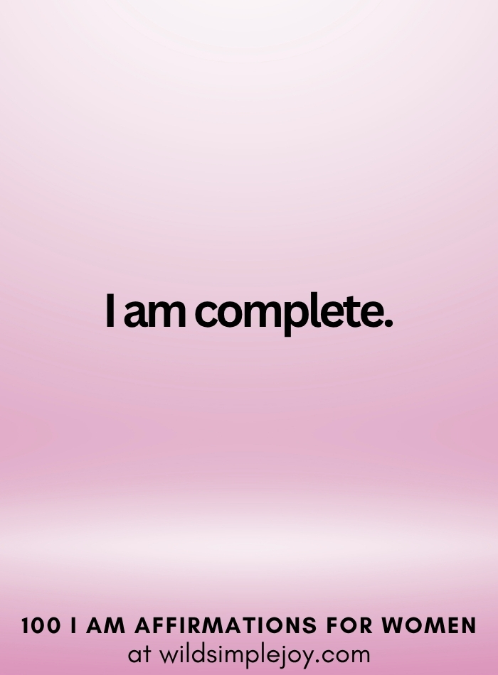 Vertical social media image with pink ombre background and text overlay that reads I am complete 100 I Am Affirmations for Women at wildsimplejoy.com