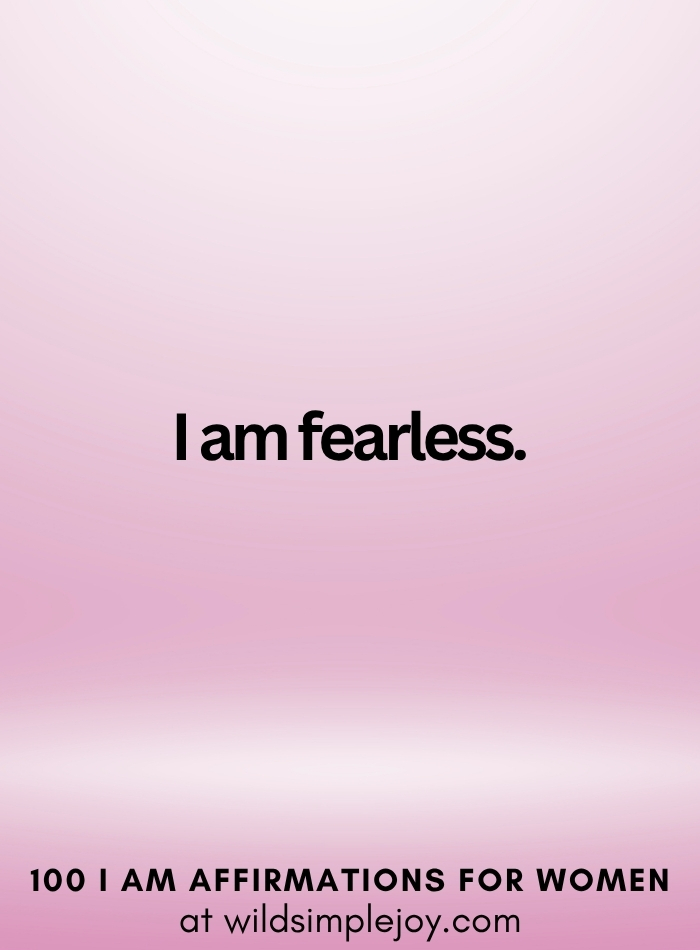 Vertical social media image with pink ombre background and text overlay that reads I am fearless 100 I Am Affirmations for Women at wildsimplejoy.com