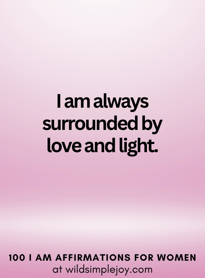 Vertical social media image with pink ombre background and text overlay that reads I am surrounded by love and light 100 I Am Affirmations for Women at wildsimplejoy.com