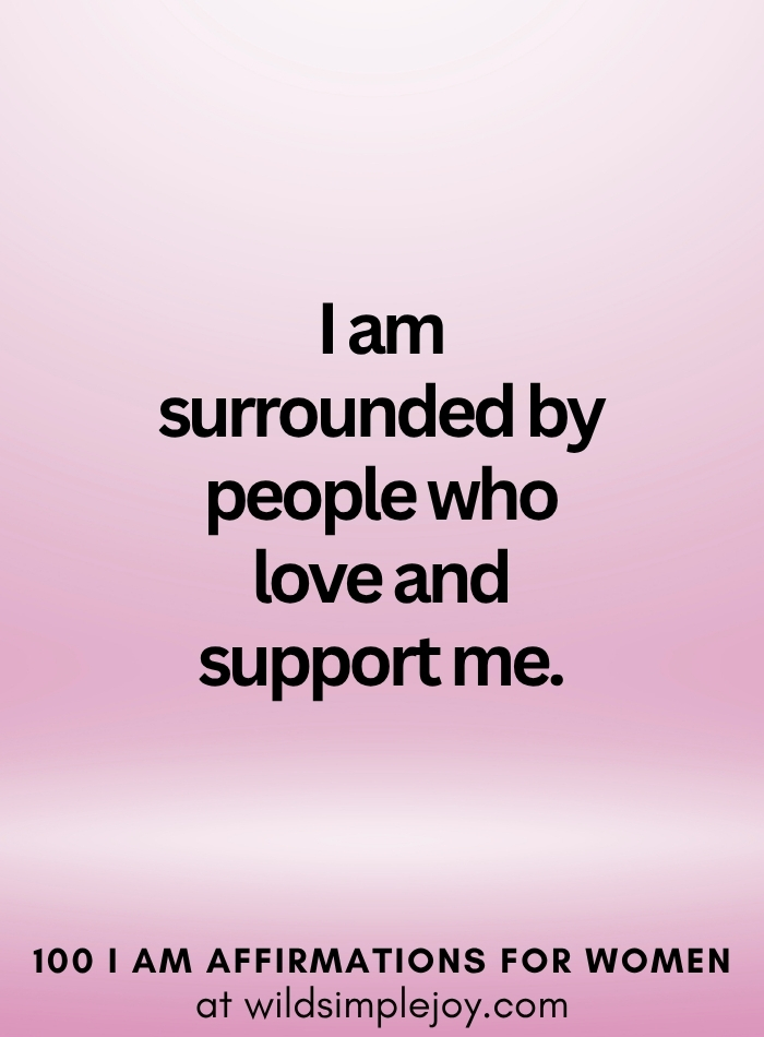 Vertical social media image with pink ombre background and text overlay that reads I am surrounded by people who love and support me 100 I Am Affirmations for Women at wildsimplejoy.com