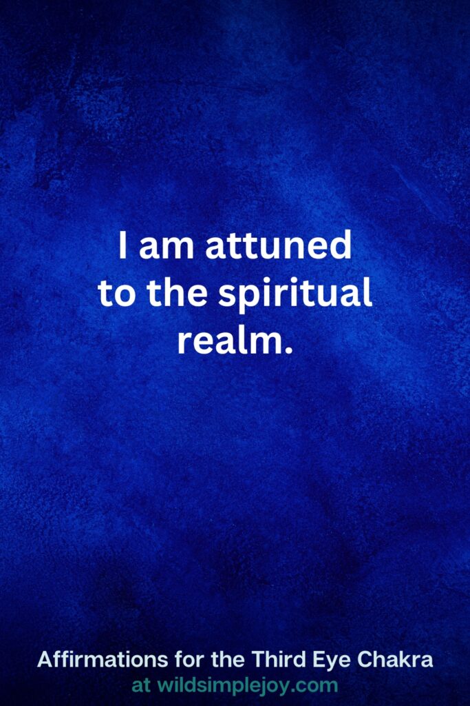 Vertical pin image on dark blue background with text overlay, I am attuned to the spiritual realm. Third Eye Chakra Affirmations at wildsimplejoy.com