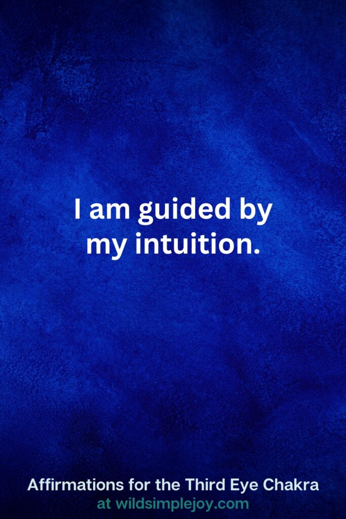 Vertical pin image on dark blue background with text overlay, I am guided by my intuition. Third Eye Chakra Affirmations at wildsimplejoy.com