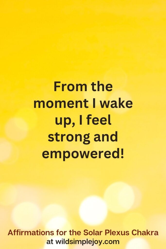 Vertical pin image with yellow background and text overlay that reads From the moment I wake up, I feel strong and empowered. Affirmations for the Solar Plexus Chakra at wildsimplejoy.com
