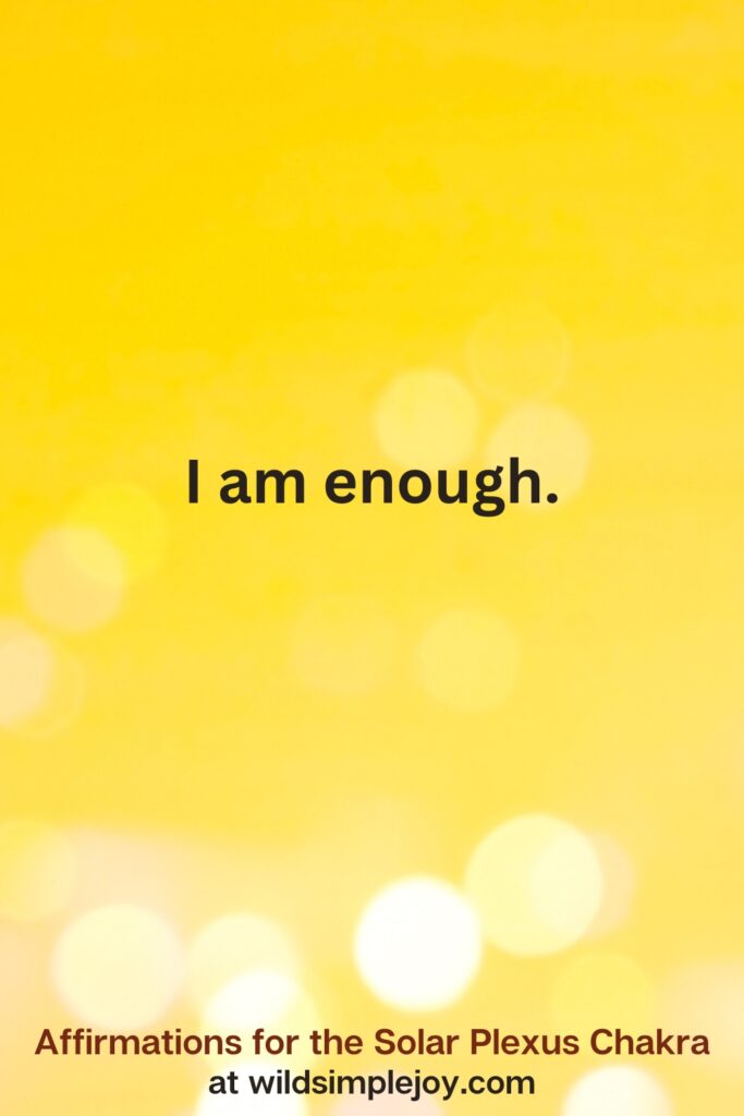 Vertical pin image with yellow background and text overlay that reads I am enough. Affirmations for the Solar Plexus Chakra at wildsimplejoy.com
