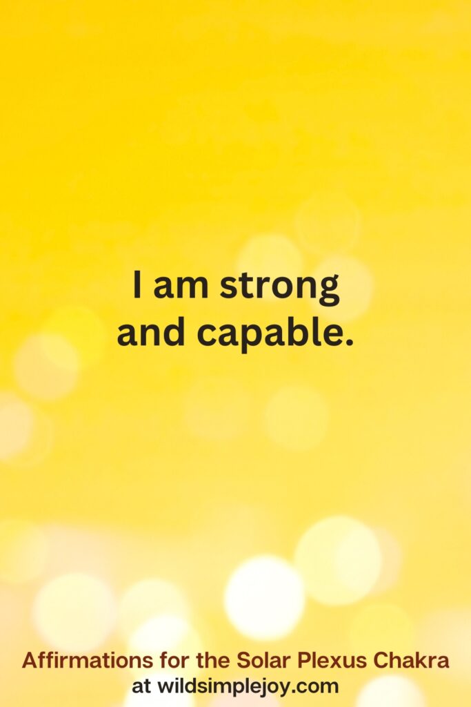 Vertical pin image with yellow background and text overlay that reads I am strong and capable. Affirmations for the Solar Plexus Chakra at wildsimplejoy.com
