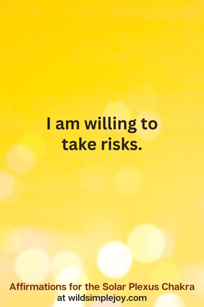 Vertical pin image with yellow background and text overlay that reads I am willing to take risks. Affirmations for the Solar Plexus Chakra at wildsimplejoy.com