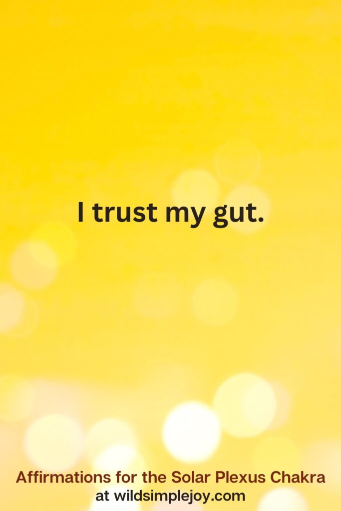 Vertical pin image with yellow background and text overlay that reads I trust my gut. Affirmations for the Solar Plexus Chakra at wildsimplejoy.com
