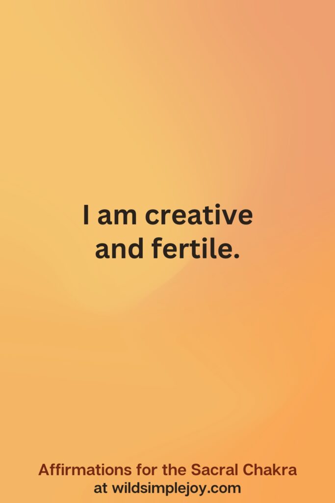 Vertical social media image on orange background with text overlay that reads I am creative and fertile. Affirmations for the Sacral Chakra at wildsimplejoy.com