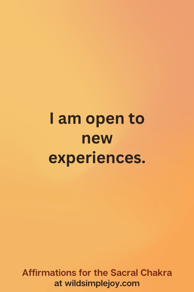 Vertical social media image on orange background with text overlay that reads I am open. Affirmations for the Sacral Chakra at wildsimplejoy.com