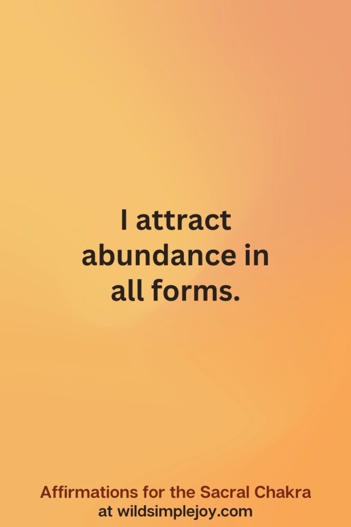 Vertical social media image on orange background with text overlay that reads I attract abundance in all forms. Affirmations for the Sacral Chakra at wildsimplejoy.com