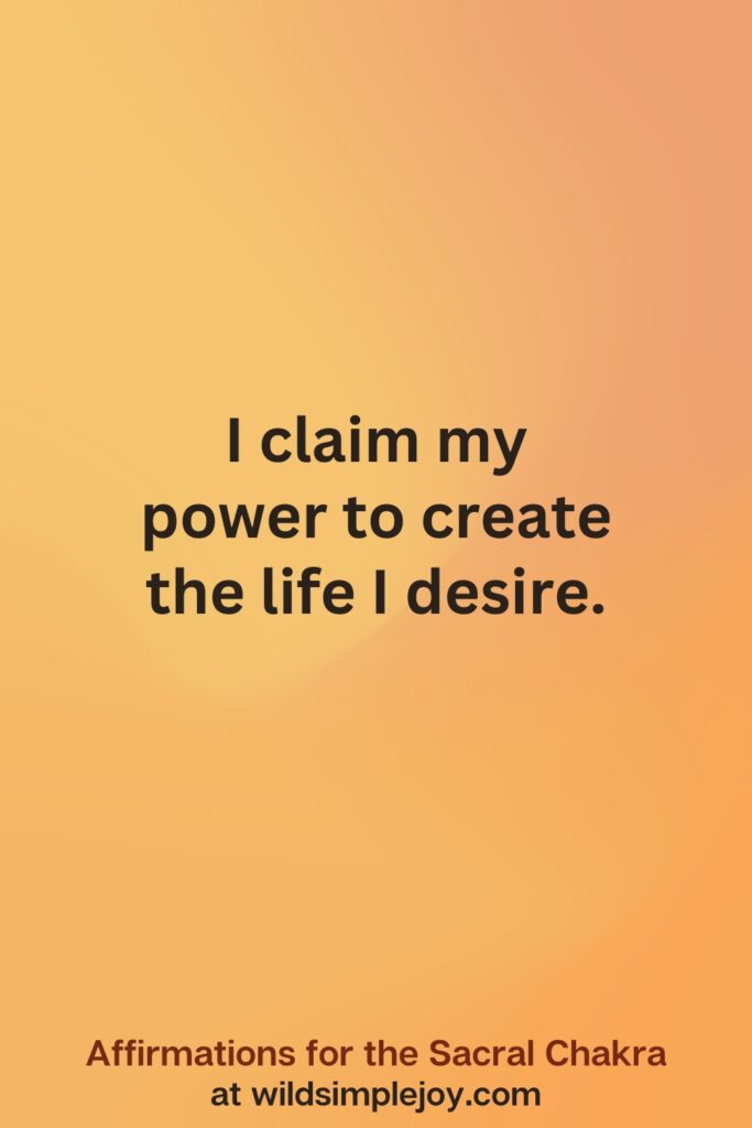 Vertical social media image on orange background with text overlay that reads I claim my power to create the life I desire. Affirmations for the Sacral Chakra at wildsimplejoy.com