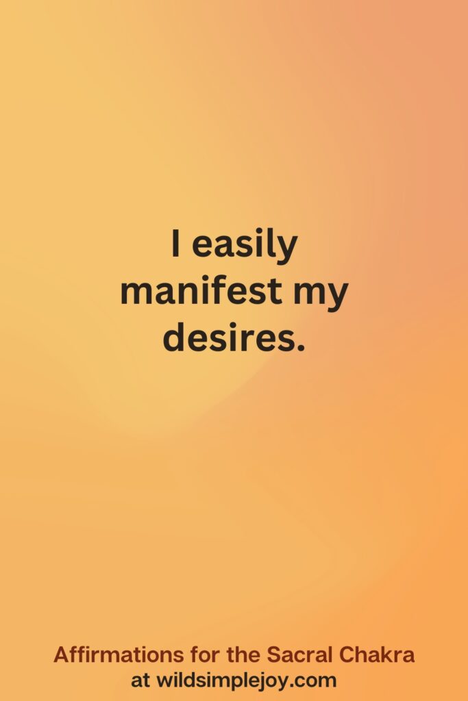 Vertical social media image on orange background with text overlay that reads I easily manifest my desires. Affirmations for the Sacral Chakra at wildsimplejoy.com