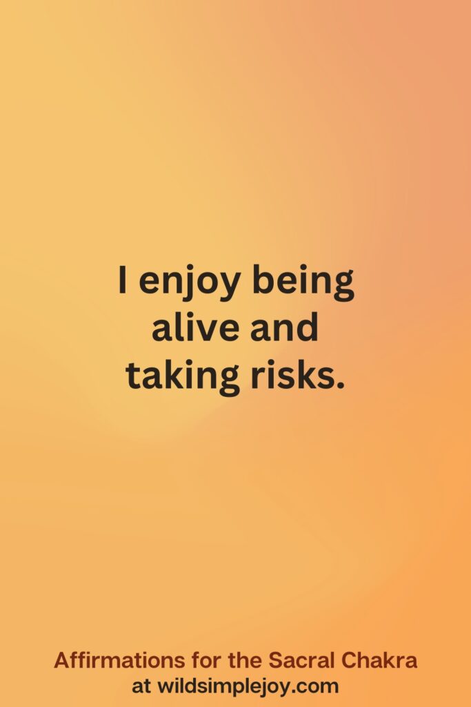Vertical social media image on orange background with text overlay that reads I emjoy being alive and taking risks. Affirmations for the Sacral Chakra at wildsimplejoy.com