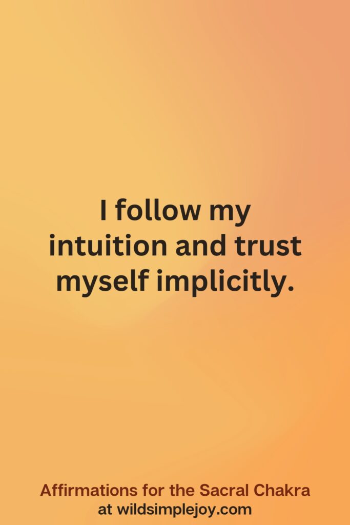 Vertical social media image on orange background with text overlay that reads I follow my intuition. Affirmations for the Sacral Chakra at wildsimplejoy.com