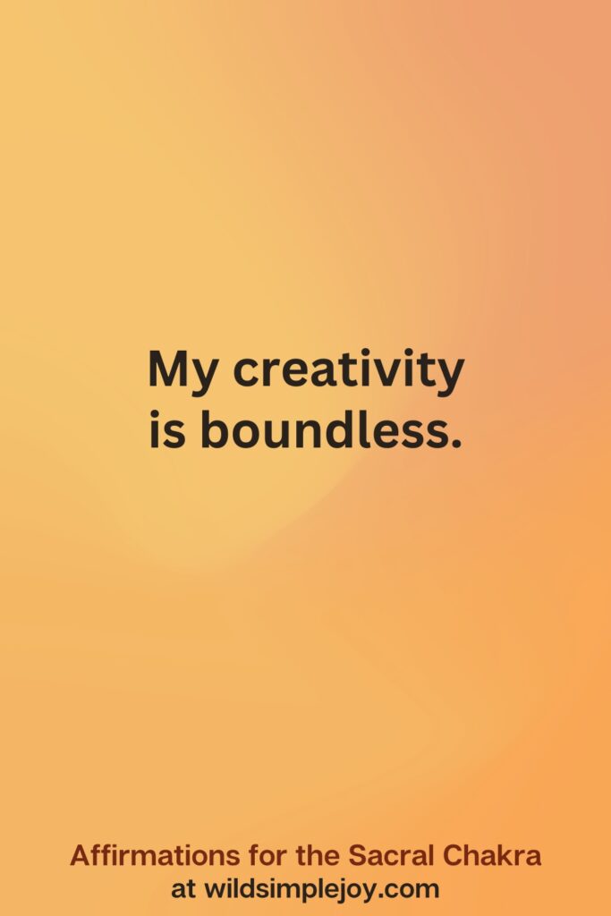 Vertical social media image on orange background with text overlay that reads My creativity is boundless Affirmations for the Sacral Chakra at wildsimplejoy.com
