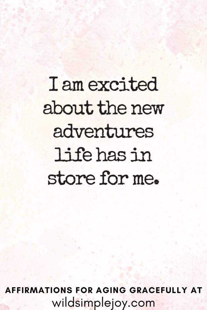 Vertical Pinterest Image on a pink background with text overlay I am excited about the new adventures life has in store for me Affirmations for Aging Gracefully at wildsimplejoy.com