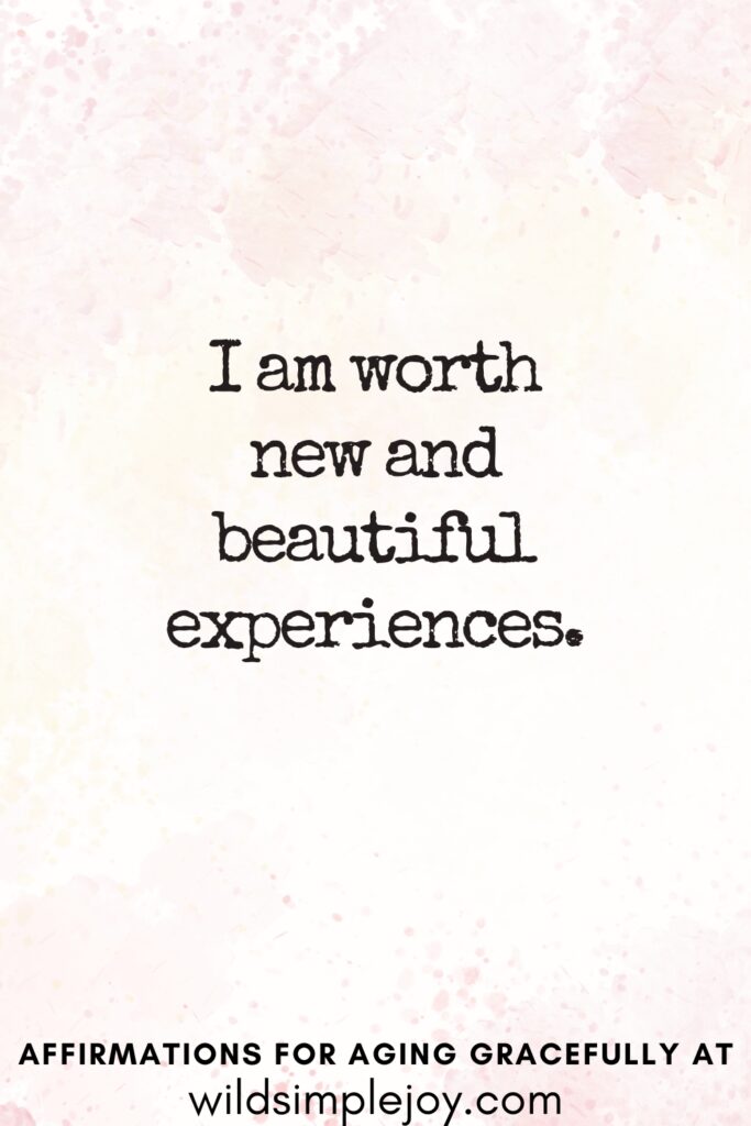 Vertical Pinterest Image on a pink background with text overlay I am worth new and beautiful experiences Affirmations for Aging Gracefully at wildsimplejoy.com
