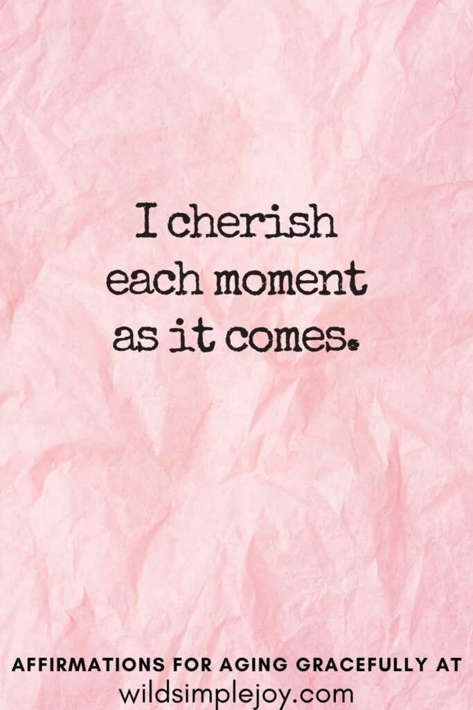 Vertical Pinterest Image on a pink background with text overlay I cherish each moment as it comes Affirmations for Aging Gracefully at wildsimplejoy.com