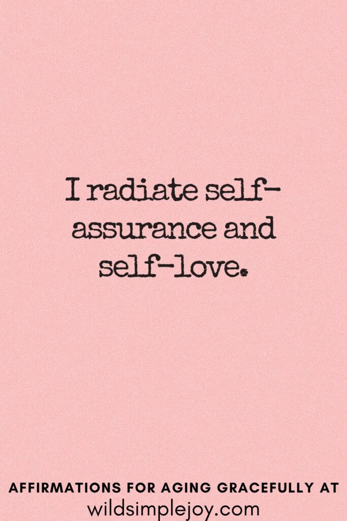 Vertical Pinterest Image on a pink background with text overlay I radiate self assurance and self-love Affirmations for Aging Gracefully at wildsimplejoy.com